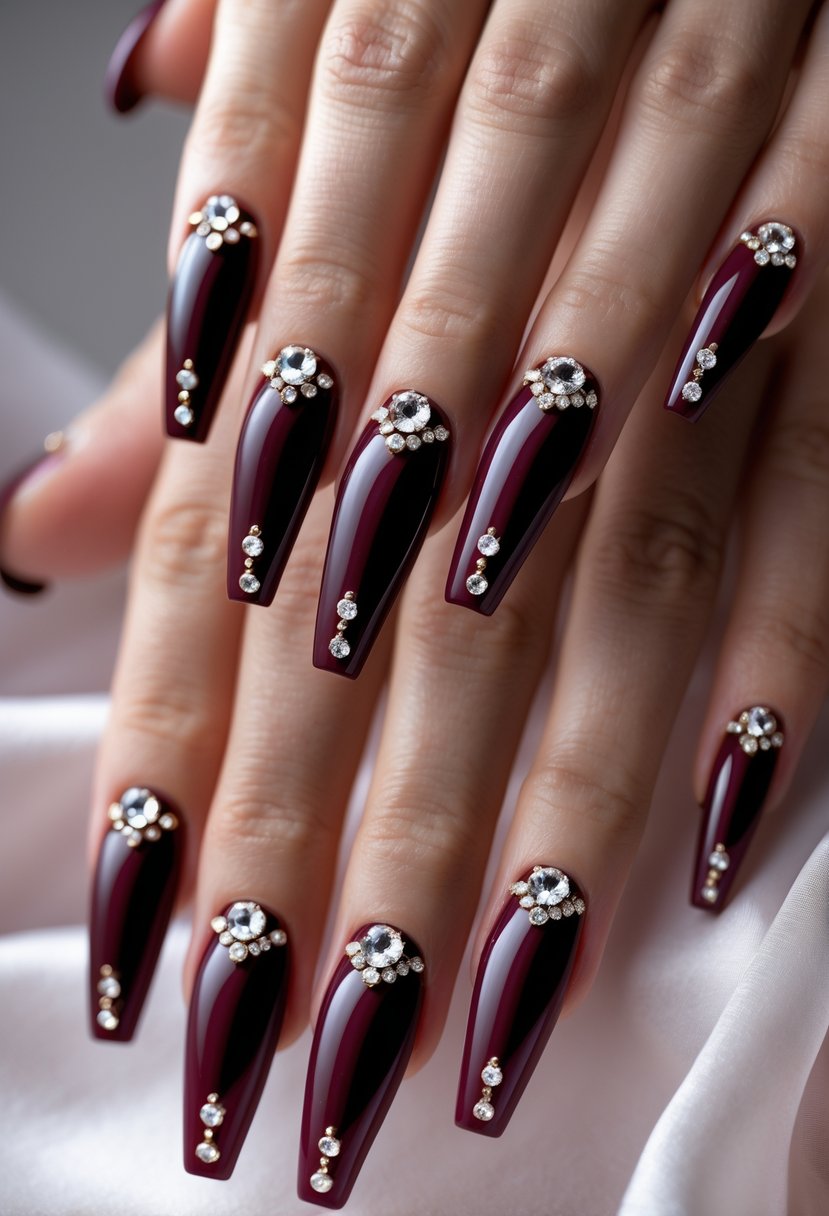 Close-up of six coffin-shaped burgundy nails with rhinestone decorations on well-groomed hands.